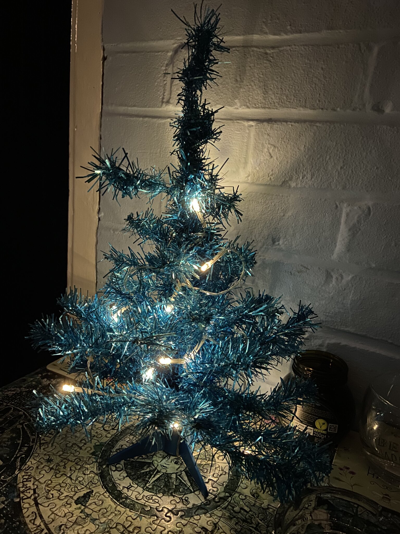 This tiny blue tinsel Christmas tree has been with me and the missus since we first got