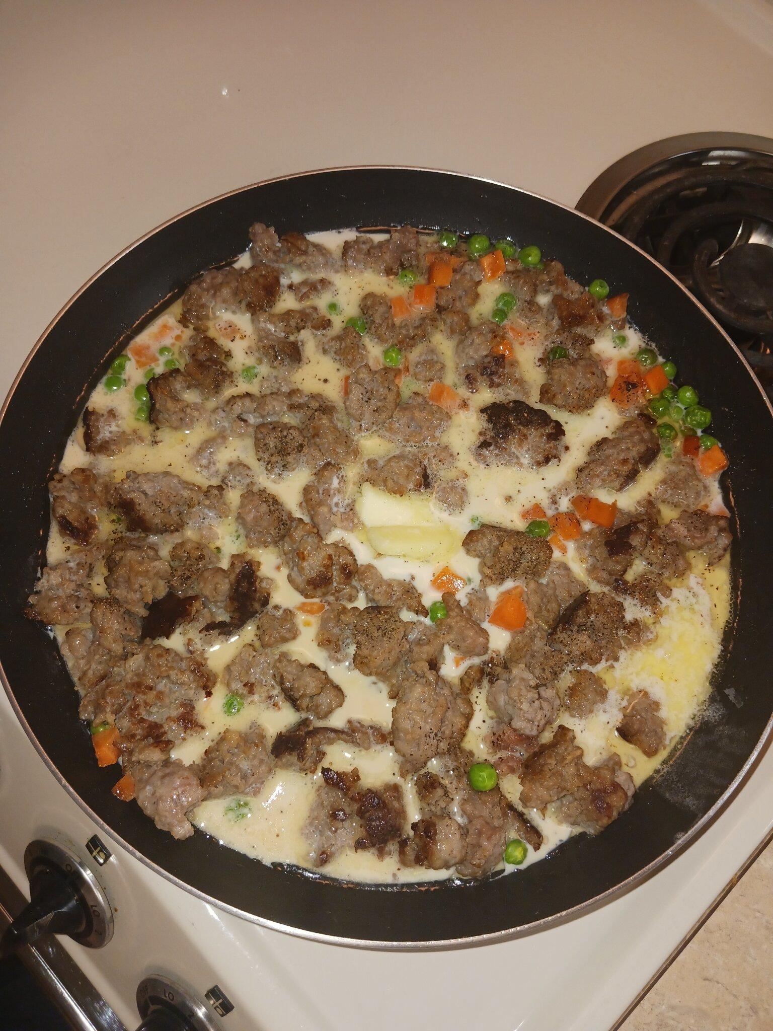 Tonight&amp;#39;s early dinner, crumbled beer bratwurst stroganoff, with peas ...
